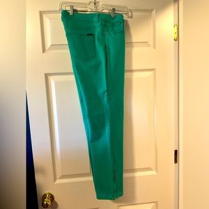 Green jeans! Tapered legs zippers at ankles. Fun and unique set yourself apart!